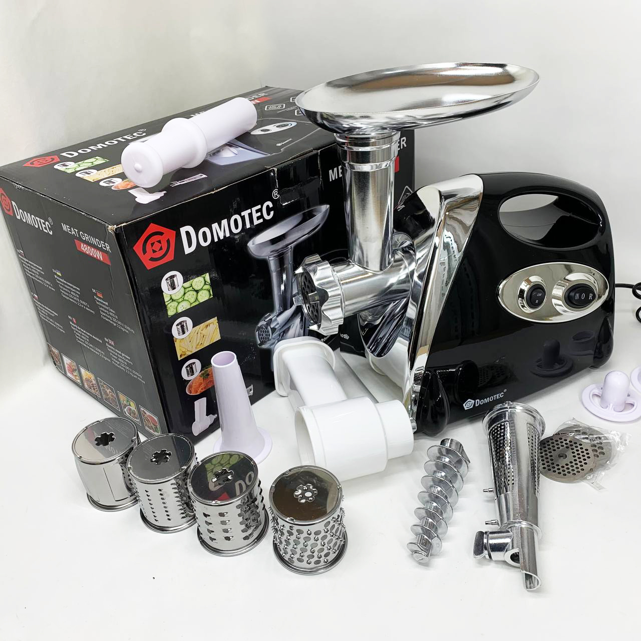 М'ясорубка електрична DOMOTEC MS-2025 3 в 1 4800 Вт із соковижималкою, терками, шатківниками та реверсом - Зображення 2