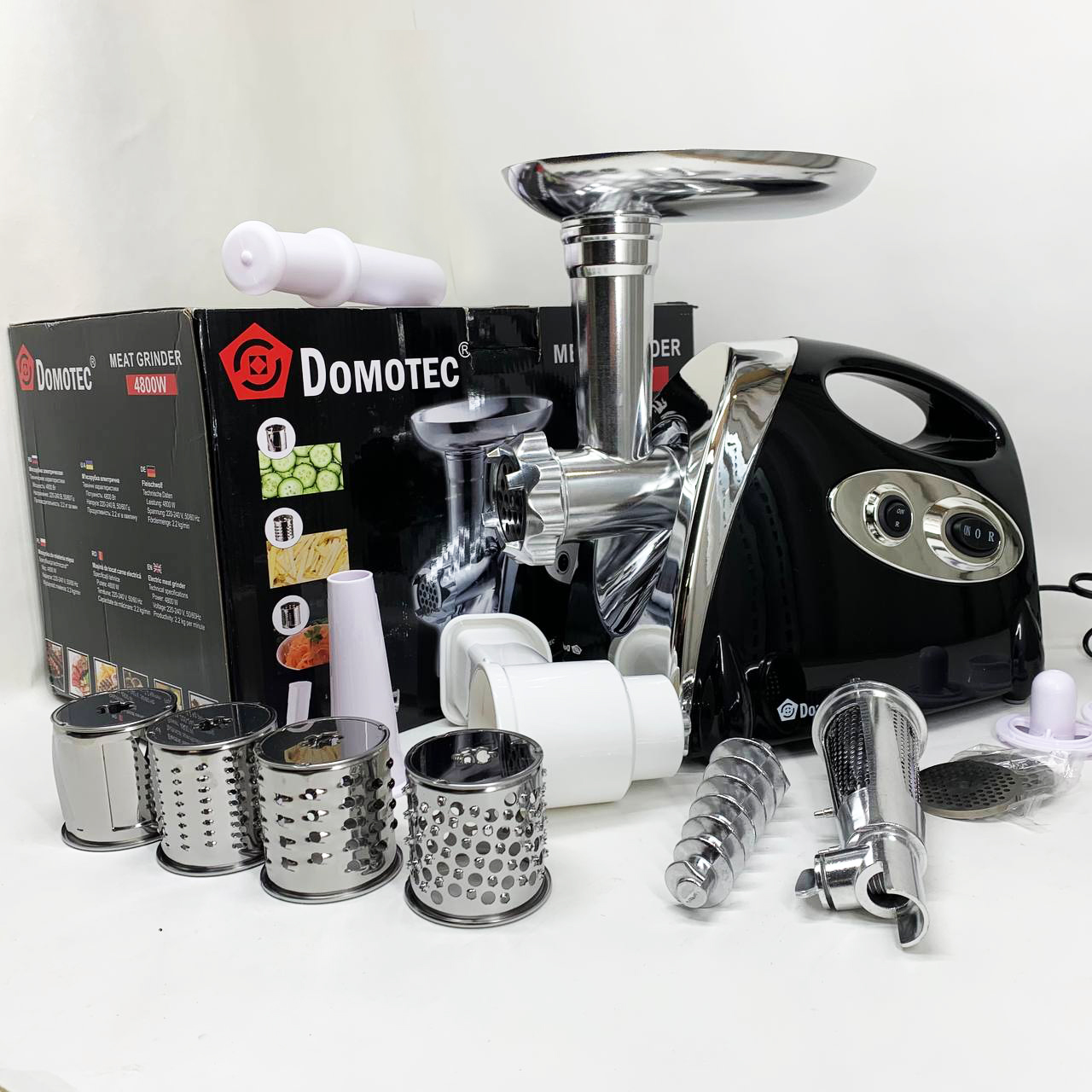 М'ясорубка електрична DOMOTEC MS-2025 3 в 1 4800 Вт із соковижималкою, терками, шатківниками та реверсом - Зображення 6